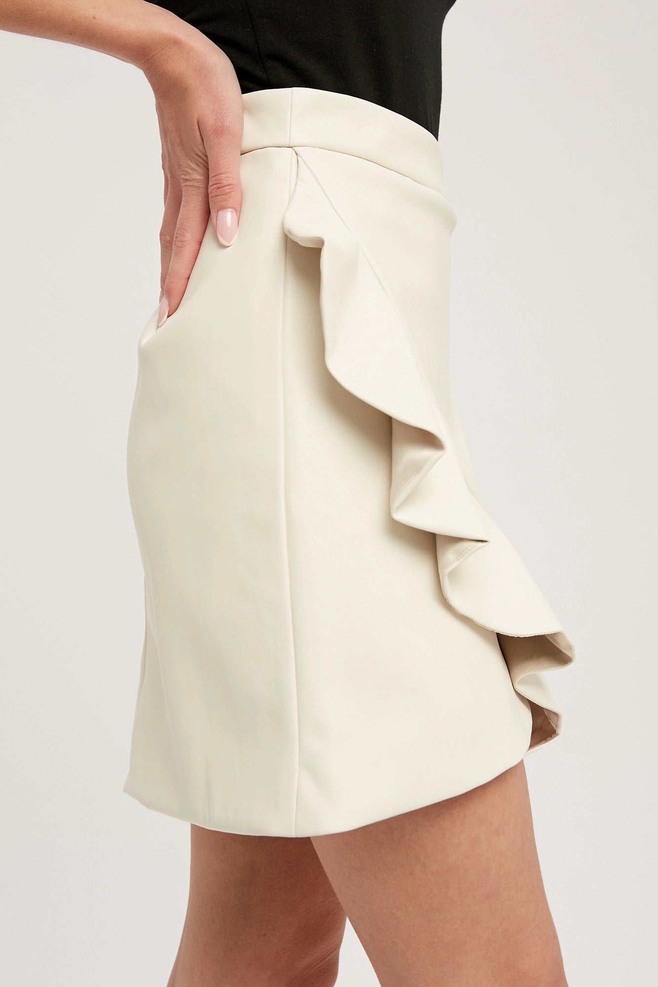 The Ariana Faux Leather Ruffled Mini Skirt (Ecru)